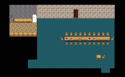 A large room with a blue rug containing a large table, surrounded by chairs. there are several dishes of food on it, and a small flower vase. A smaller table sits to the side with a single chair. a small attatched room contains an oven, refrigerator, and wooden counters lining the walls.